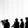 Silhouettes of film crew members